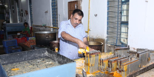 Staff work in the candle-making unit of the Association