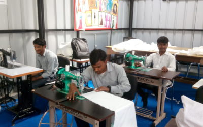 Trainees working in an industry's sewing unit post-training