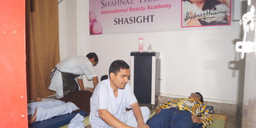 Trainees practicing massage in the Relaxation Massage Training Programme