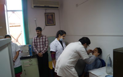 Staff from Sri Govind Tricentenary Dental College conducting check-ups for the school students