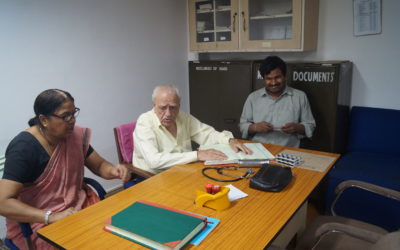 Dr. Baijal, the visiting doctor along with the nurse and a patient at the Association's clinic