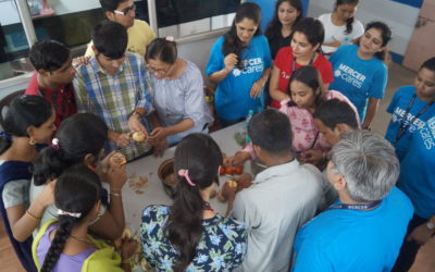 Volunteers from Mercer conduct a cooking-workshop for the vocational trainees
