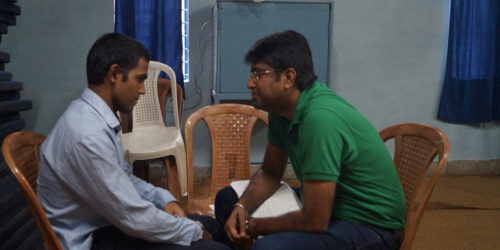 A trainee in discussion with his mentor from HSBC